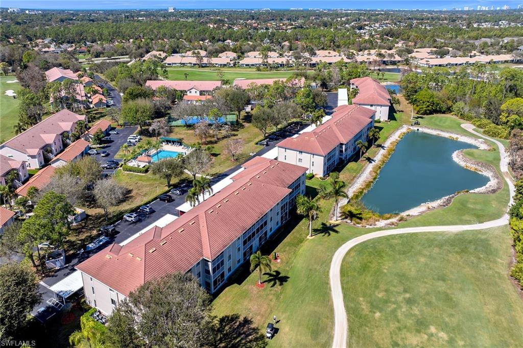 Drone / aerial view of a local golf course and a large body of water