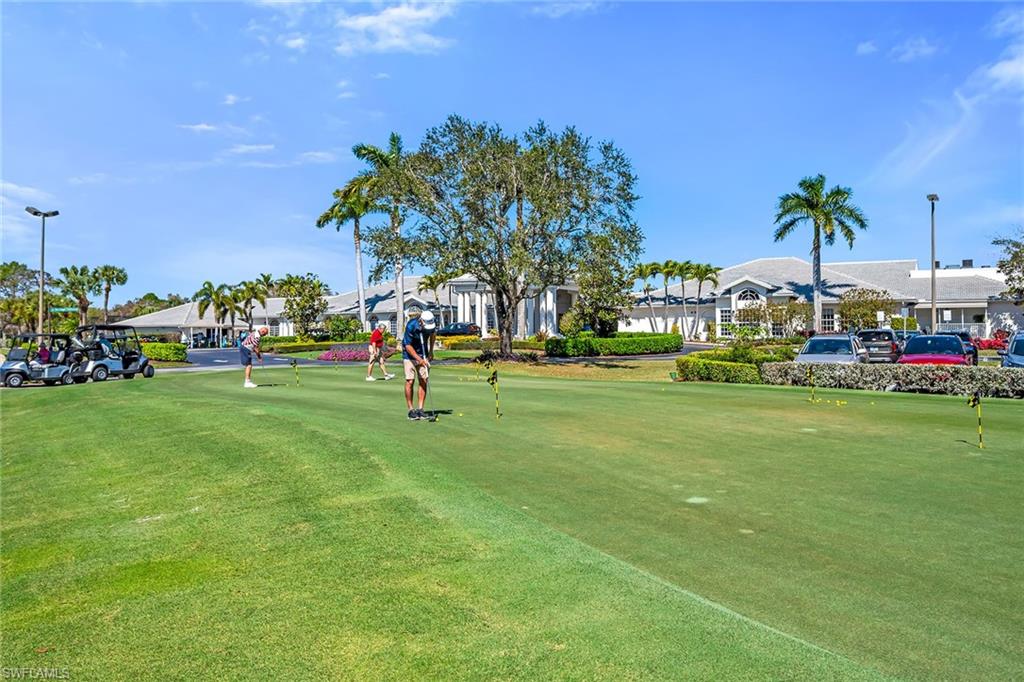 View of property's community with an area to practice putting