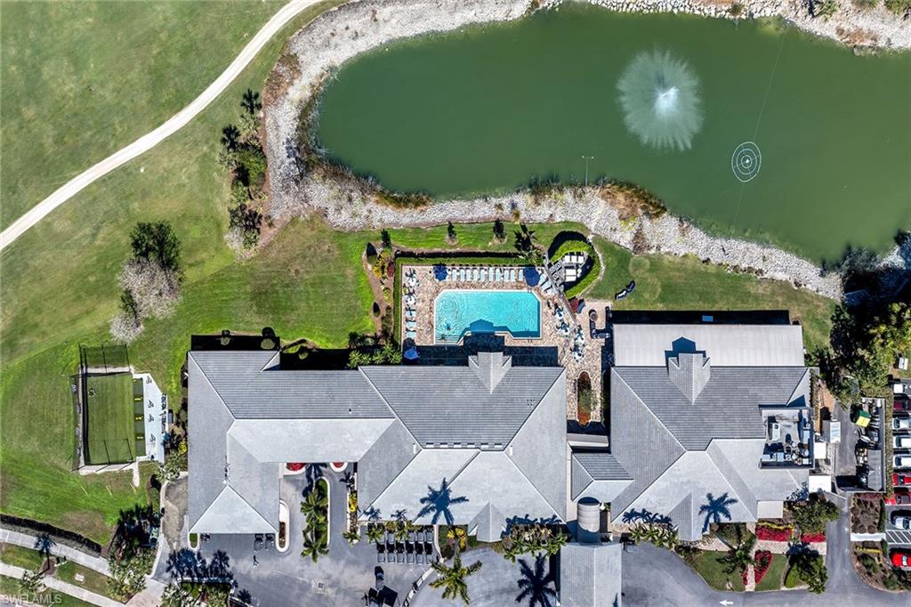Bird's eye view of a pool area and a large body of water