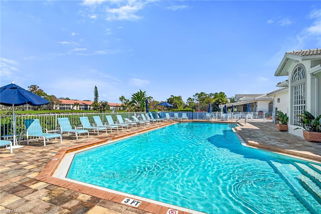 Community pool featuring a patio