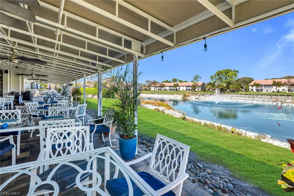 View of patio / terrace with a water view, outdoor dining area, and ceiling fan