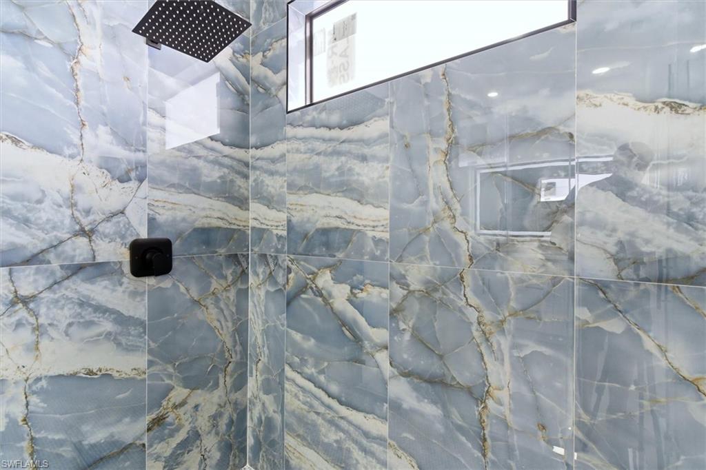 Bathroom view of a marble finish shower