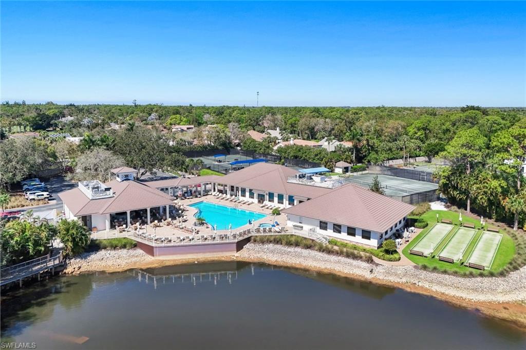 Bird's eye view of a pool and a large body of water