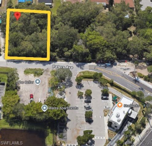 Aerial view of property's location featuring property parcel outlined