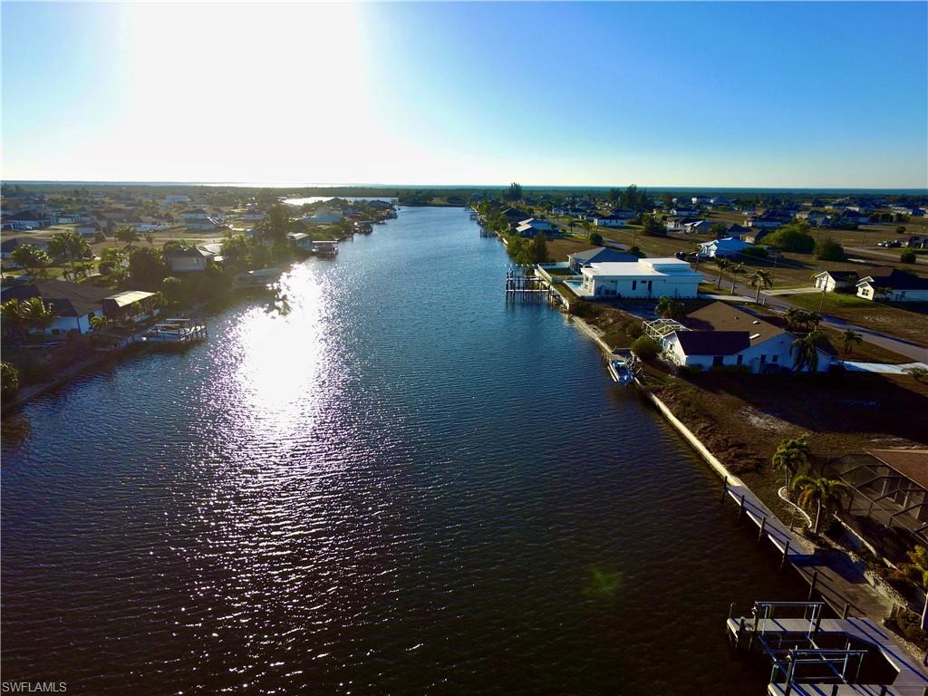 Aerial view of residential area featuring a large body of water