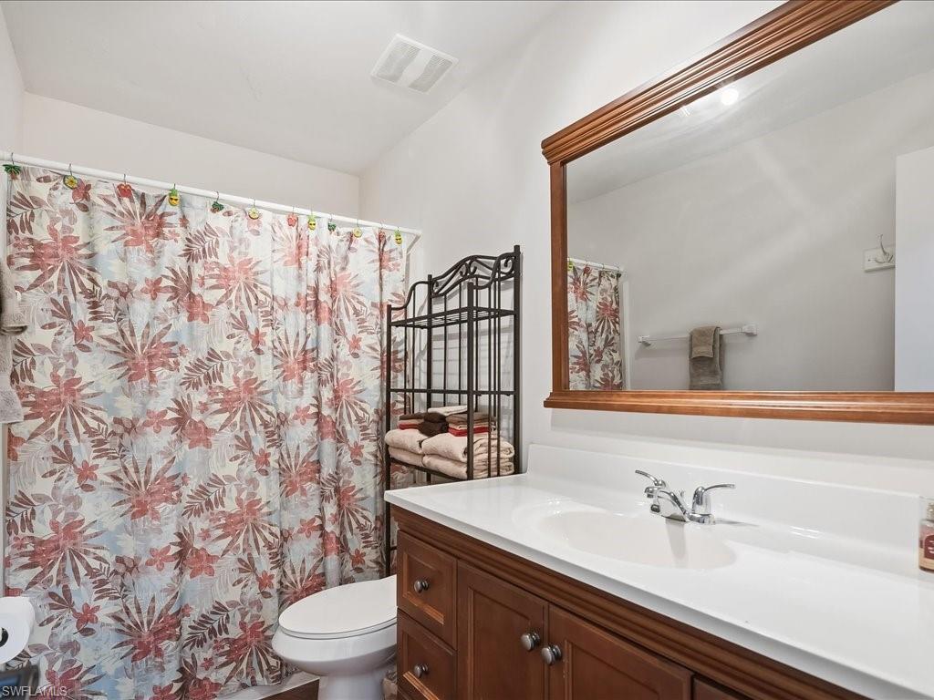 Bathroom featuring vanity and a shower with curtain