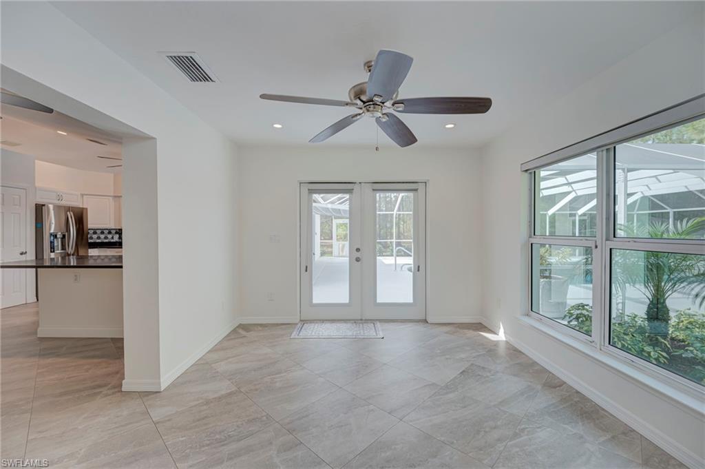Entryway featuring a ceiling fan, french doors, and recessed lighting