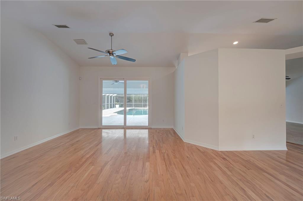 Unfurnished room featuring light wood-type flooring, ceiling fan, and recessed lighting