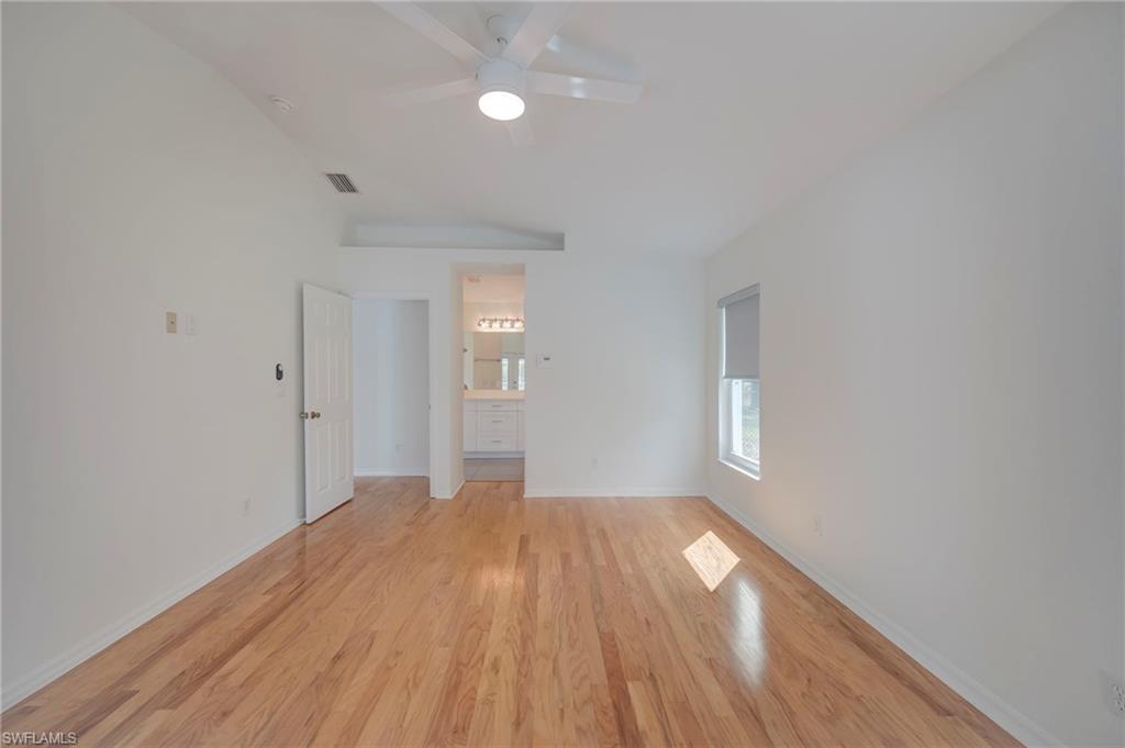 Unfurnished living room featuring light wood-style flooring and ceiling fan