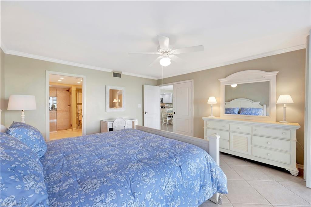 Primary Bedroom Suite with King Bed,  Smart TV, walk-in closet, desk and en suite bath.