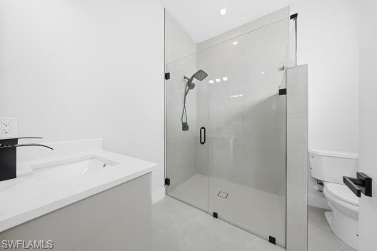 Bathroom featuring vanity and a shower stall