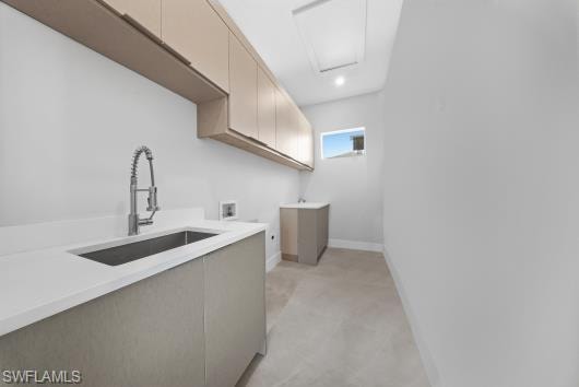 Laundry area featuring cabinet space, hookup for a washing machine, and light colored carpet