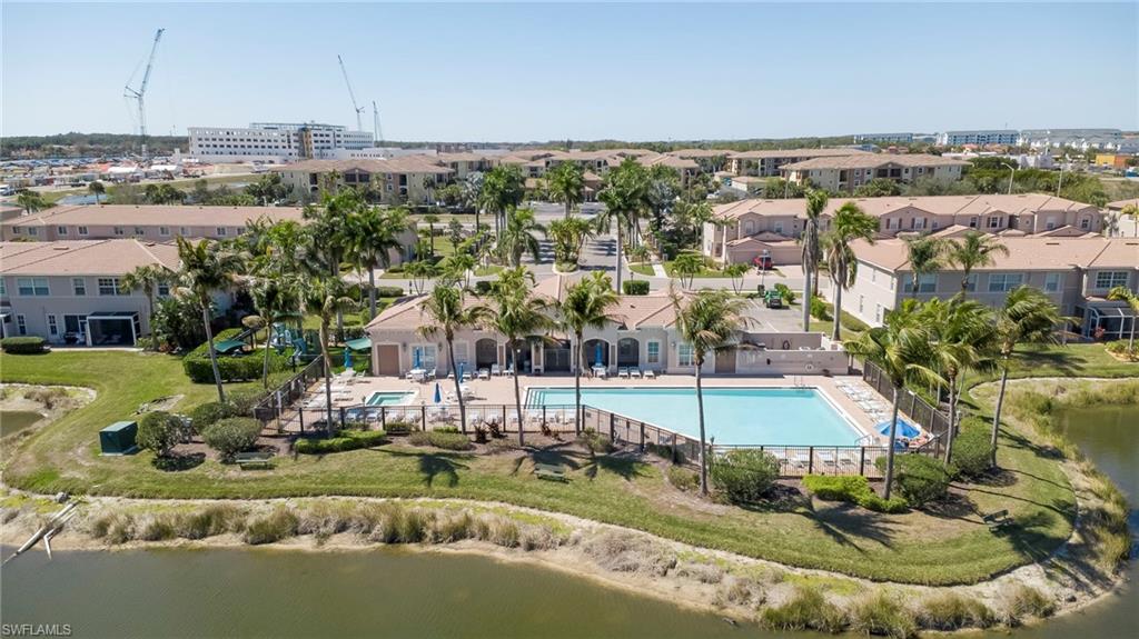 Bird's eye view of a pool and a nearby body of water