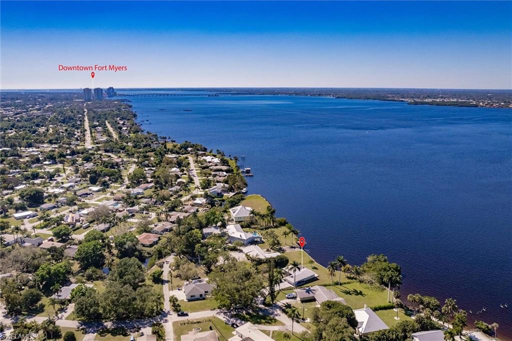 Aerial view with a water view and a residential view