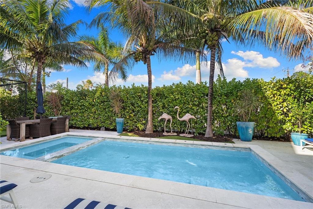 Combined pool / hot tub with a patio