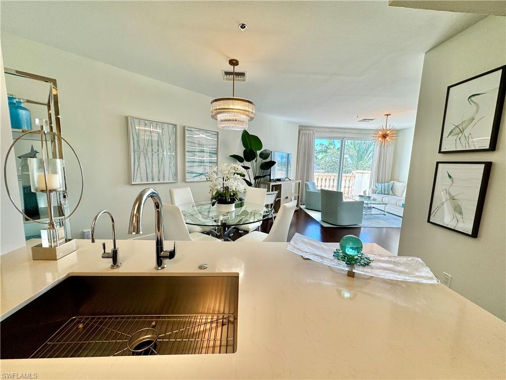 Kitchen with sink and hanging light fixtures