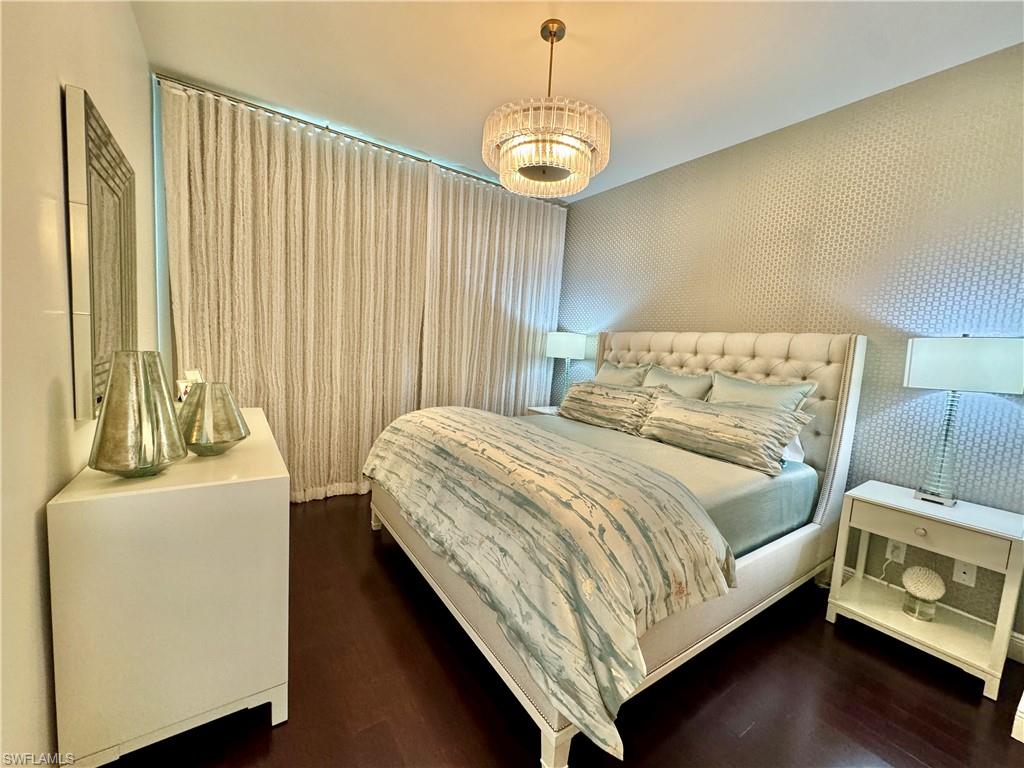 Bedroom with dark wood-type flooring