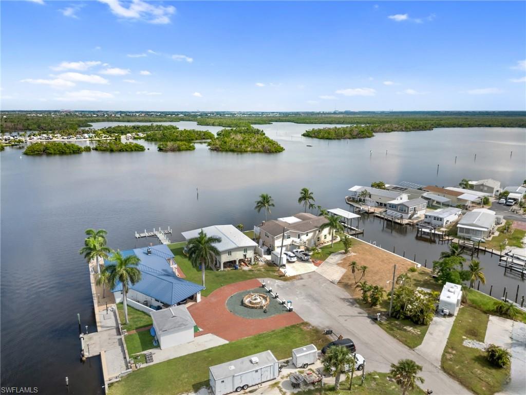 Aerial perspective of suburban area with a large body of water
