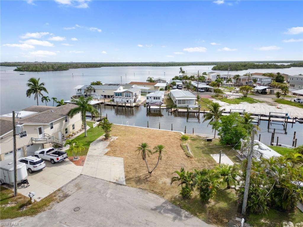 Aerial view of residential area featuring a large body of water
