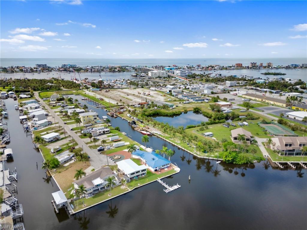 Aerial perspective of suburban area with a large body of water