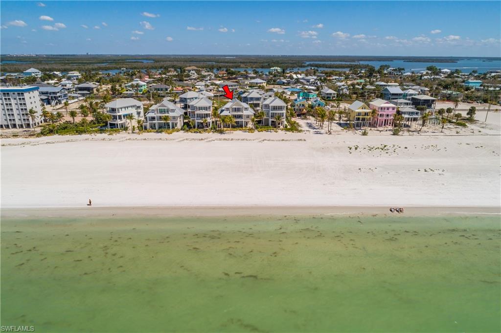 Aerial view of residential area with expansive beach