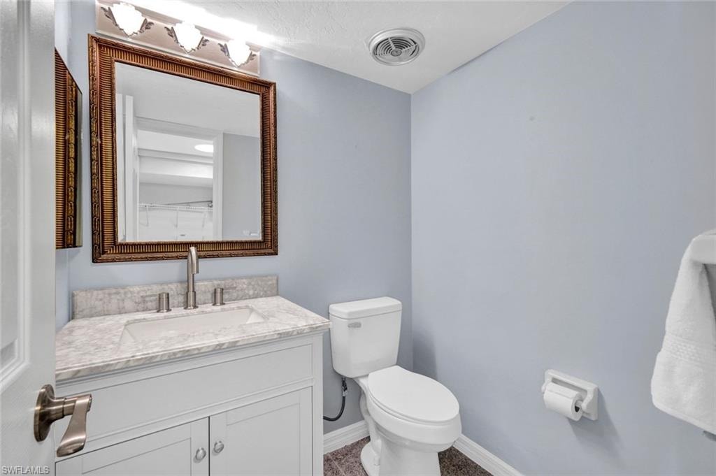 Bathroom featuring toilet and vanity