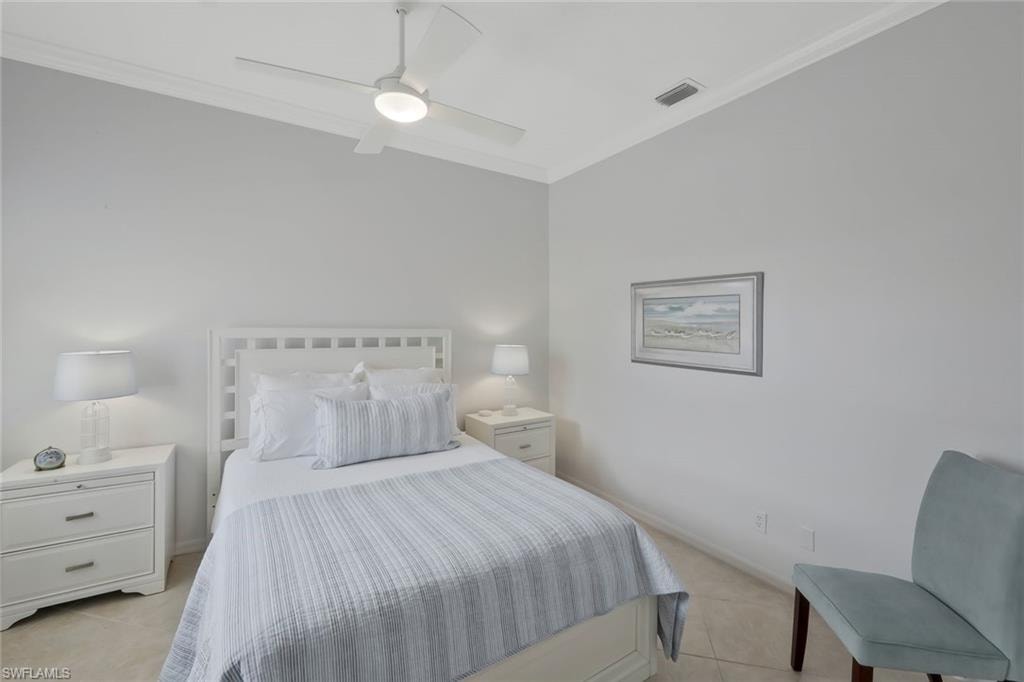 uest bedroom with high ceilings and abundant natural light creating a welcoming retreat for visitors.