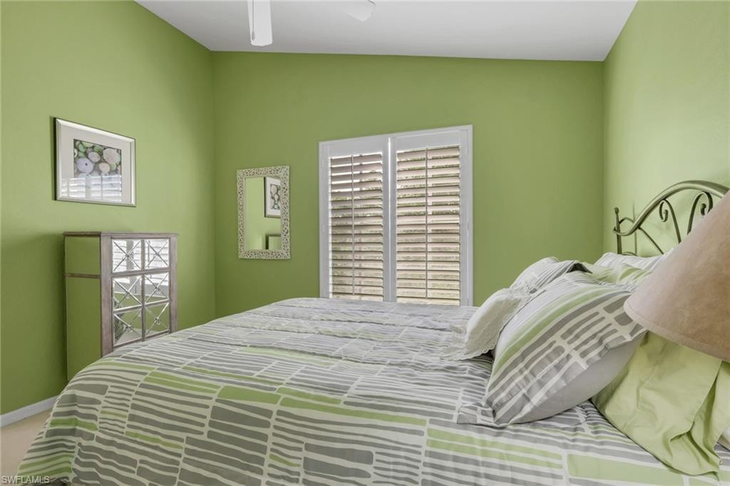 Bedroom featuring plantation shutters