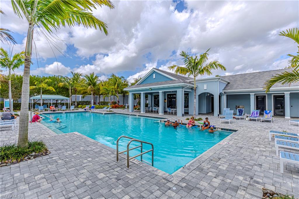 Community pool featuring a patio
