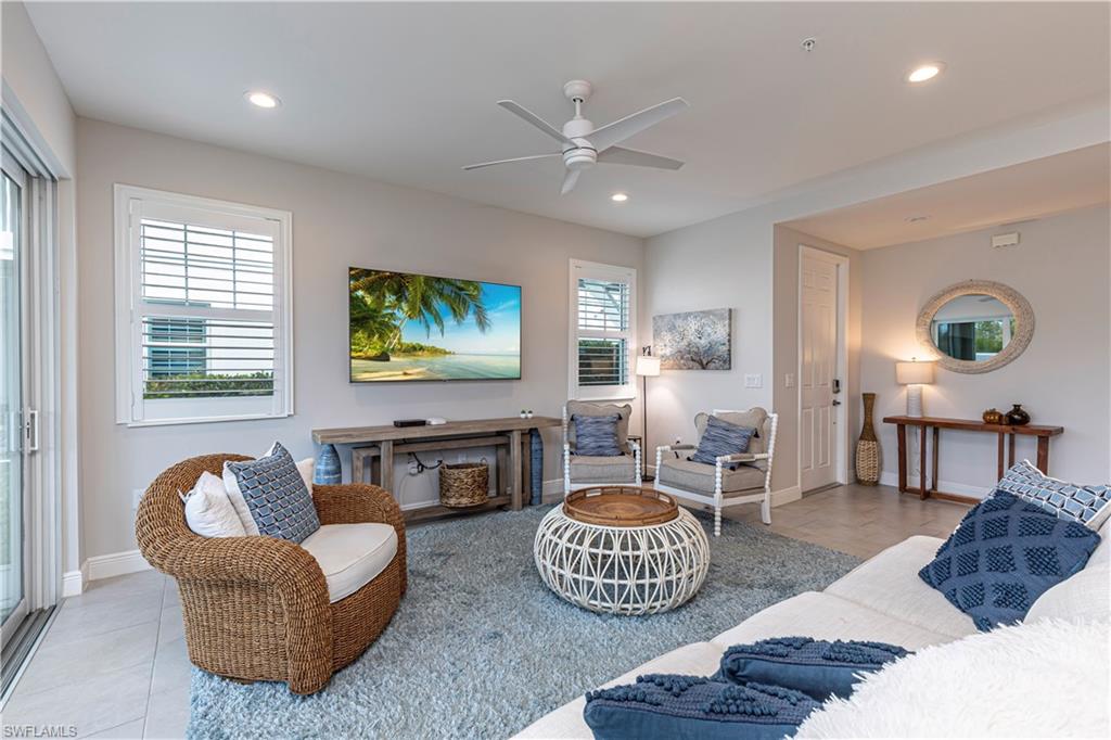 Family room featuring ceiling fan & recessed lighting