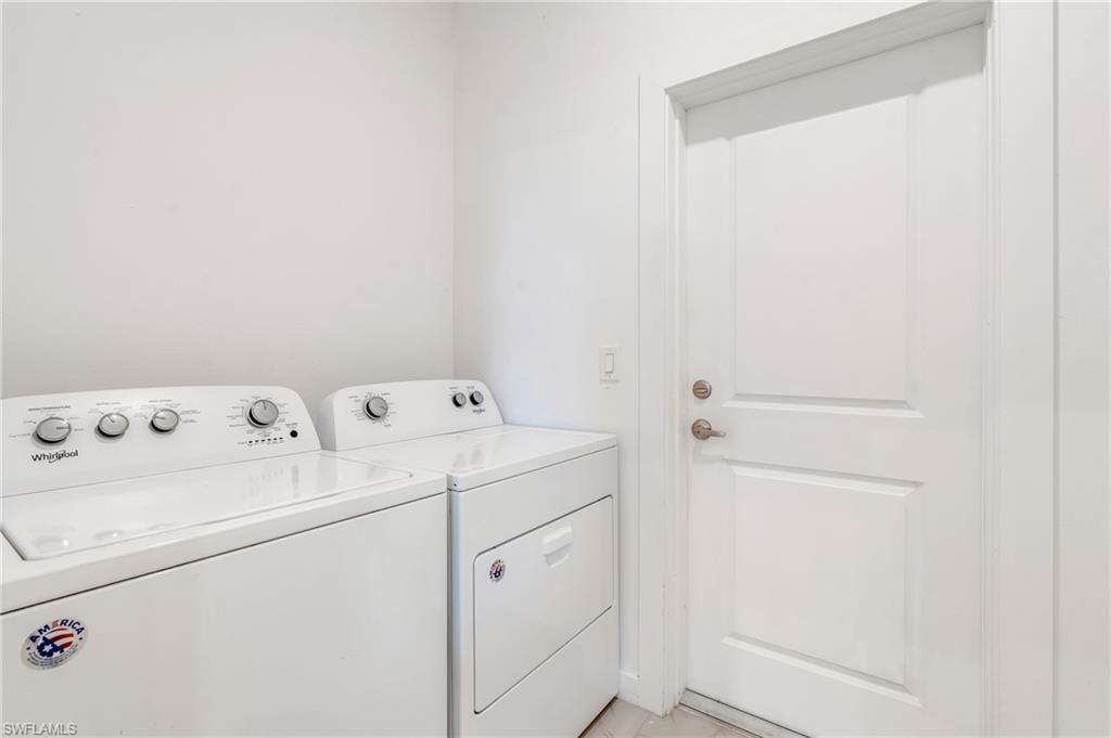 Washroom featuring independent washer and dryer