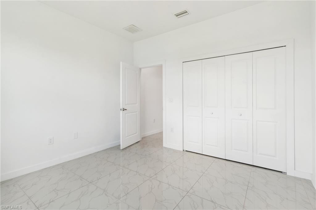 Unfurnished bedroom with a closet