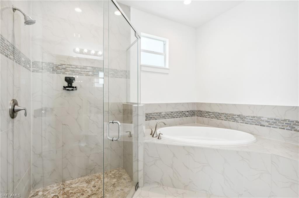 Bathroom with shower with separate bathtub