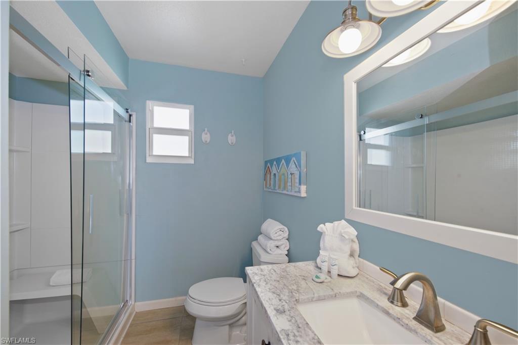 Master Bathroom: Well-maintained bathroom with a glass-enclosed shower - Virtually Edited Image