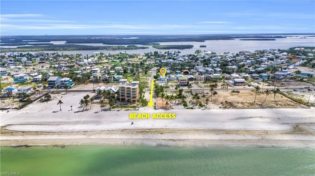 Aerial view showcasing beach access - Virtually Edited Image