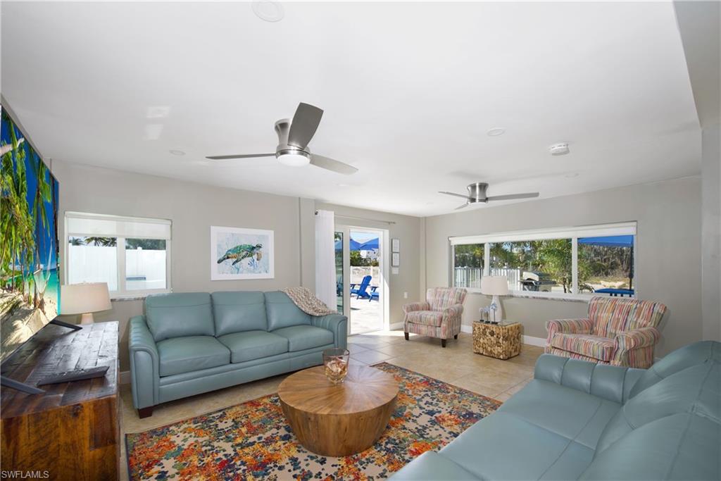 Spacious living area with ample natural light - Virtually Edited Image
