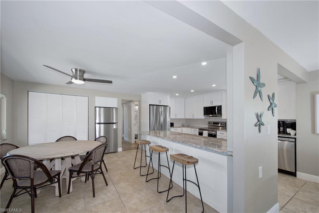 Kitchen with a breakfast bar for casual dining - Virtually Edited Image