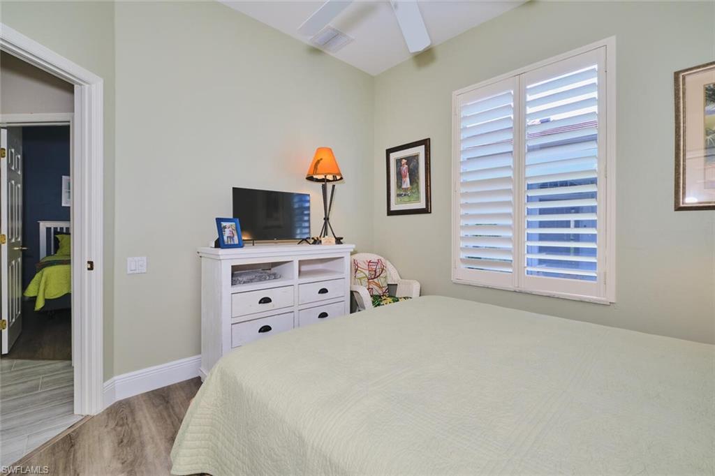 Bedroom with wood finished floors and ceiling fan