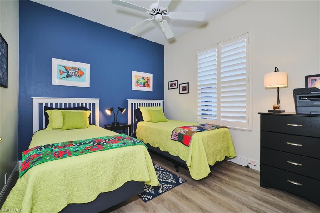 Bedroom with light wood finished floors and ceiling fan