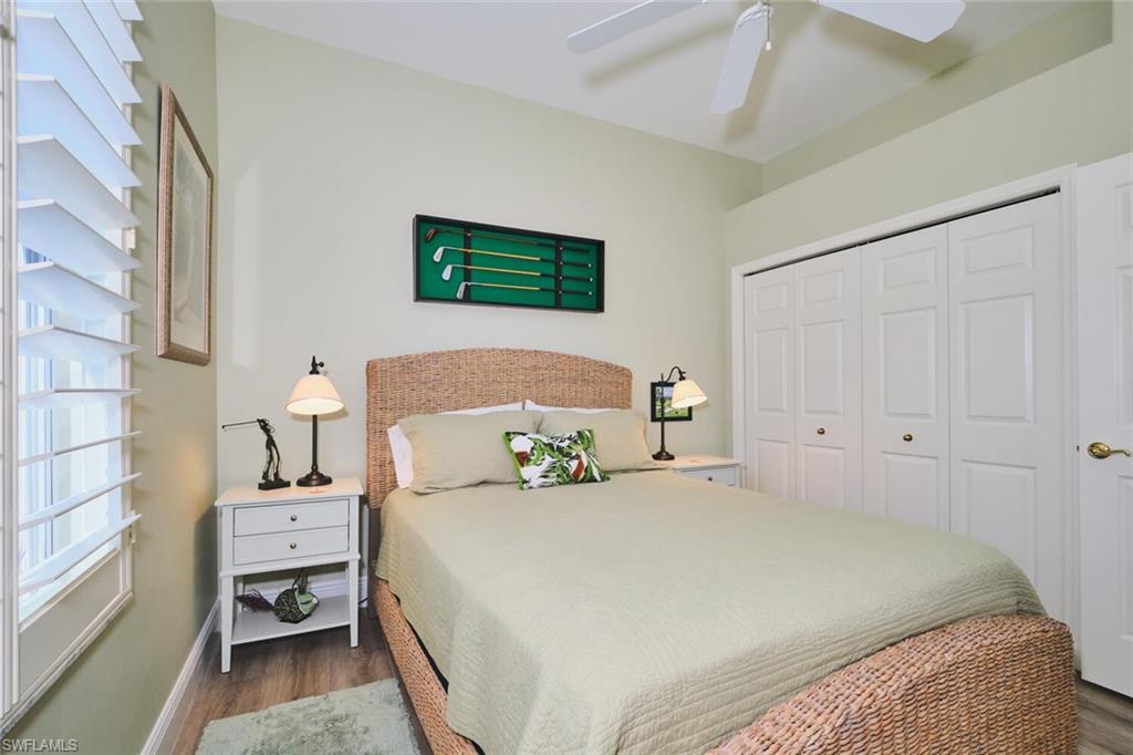 Bedroom featuring ceiling fan, wood finished floors, and a closet