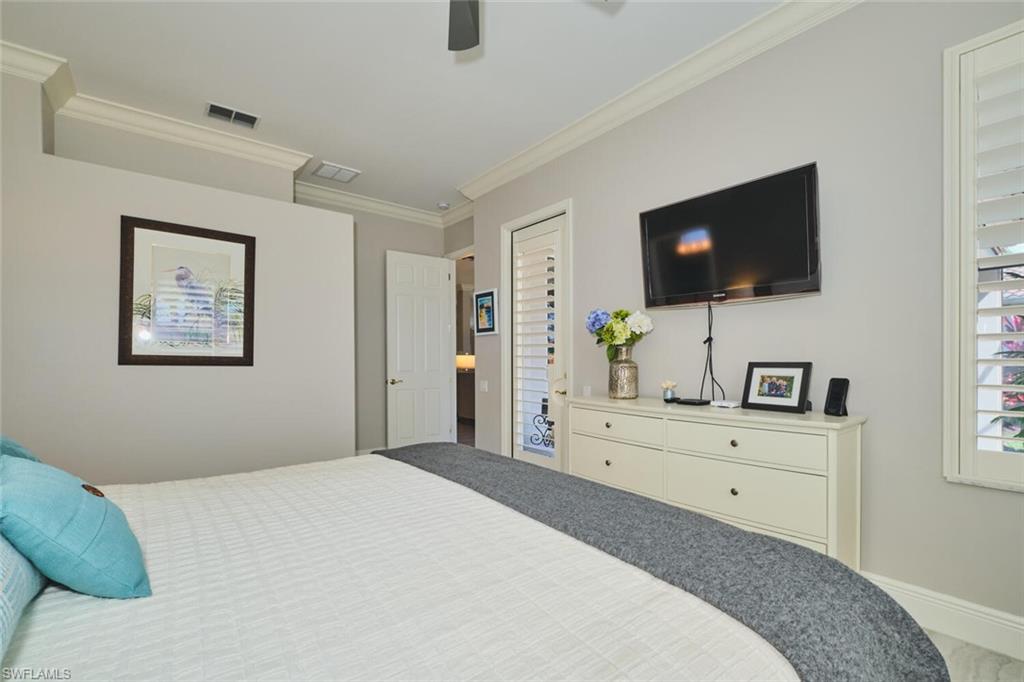 Bedroom featuring crown molding and ceiling fan