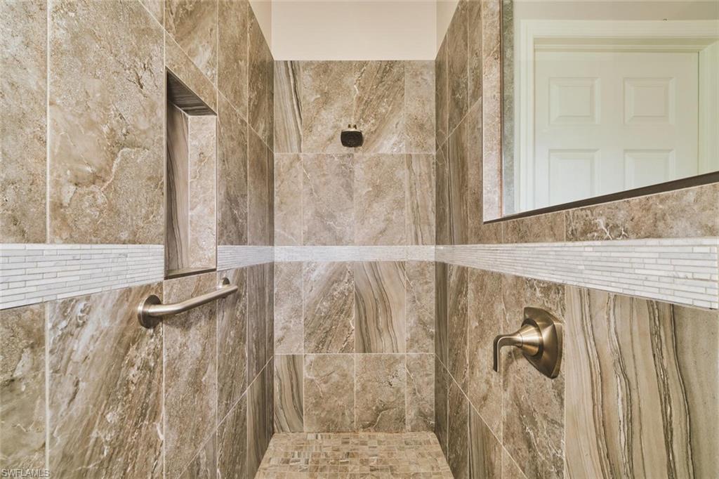 Bathroom featuring a tile shower