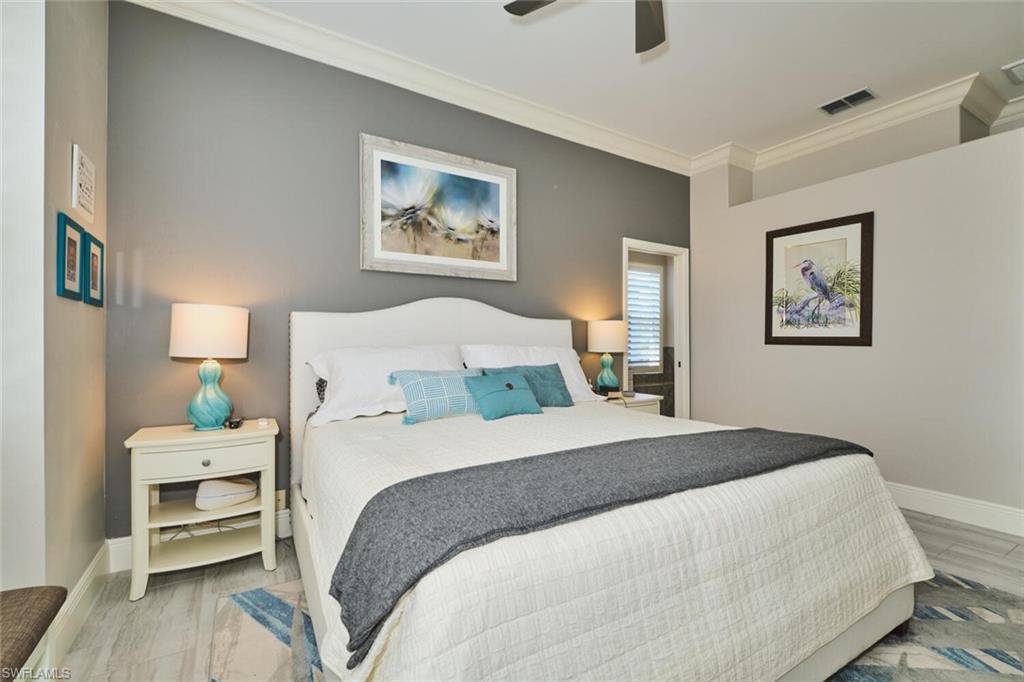 Bedroom with crown molding and ceiling fan