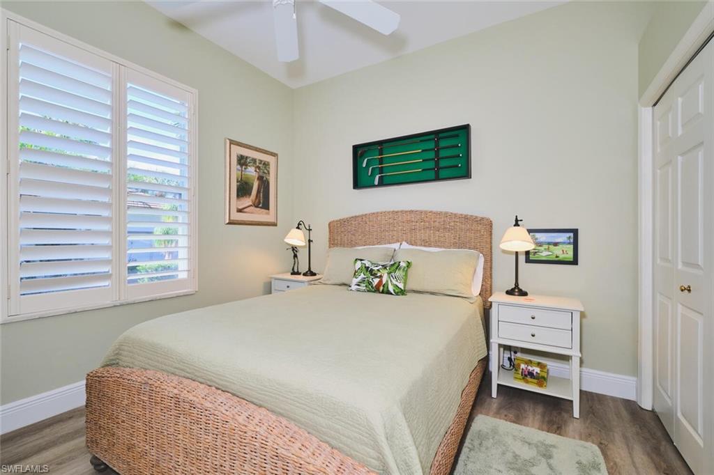Bedroom featuring a closet, wood finished floors, and ceiling fan