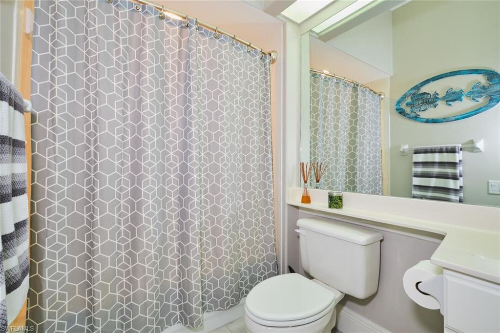 Full bath featuring vanity and a shower with curtain