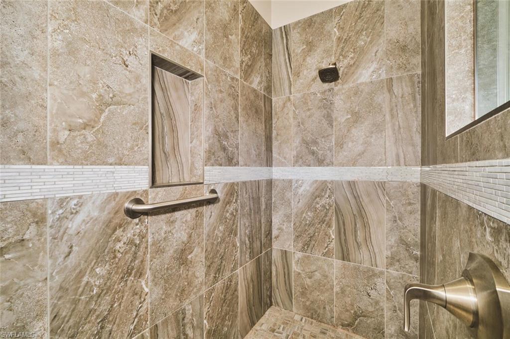 Bathroom view of a tile shower