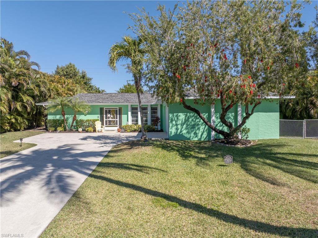 View of Front Street Elevation from Front Right [Note Left/Right Property Privacy-Lined Areca Palms]
