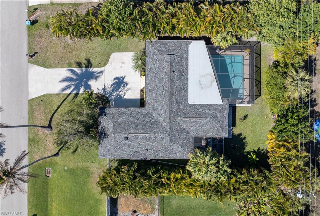 Aerial View of New Owens-Corning 50/yr True Definition Designer-Series Roof with Sure Nail Technology [up to 200mph with 10X bundles in attic along with New Solar Attic Fan.... transferrable warranty....Newly Installed Custom-Designed Pier Pilings Hand Painted Mailbox . . .  Perimeter-Privacy Lined Areca Palms [Utility Lines in the Rear]