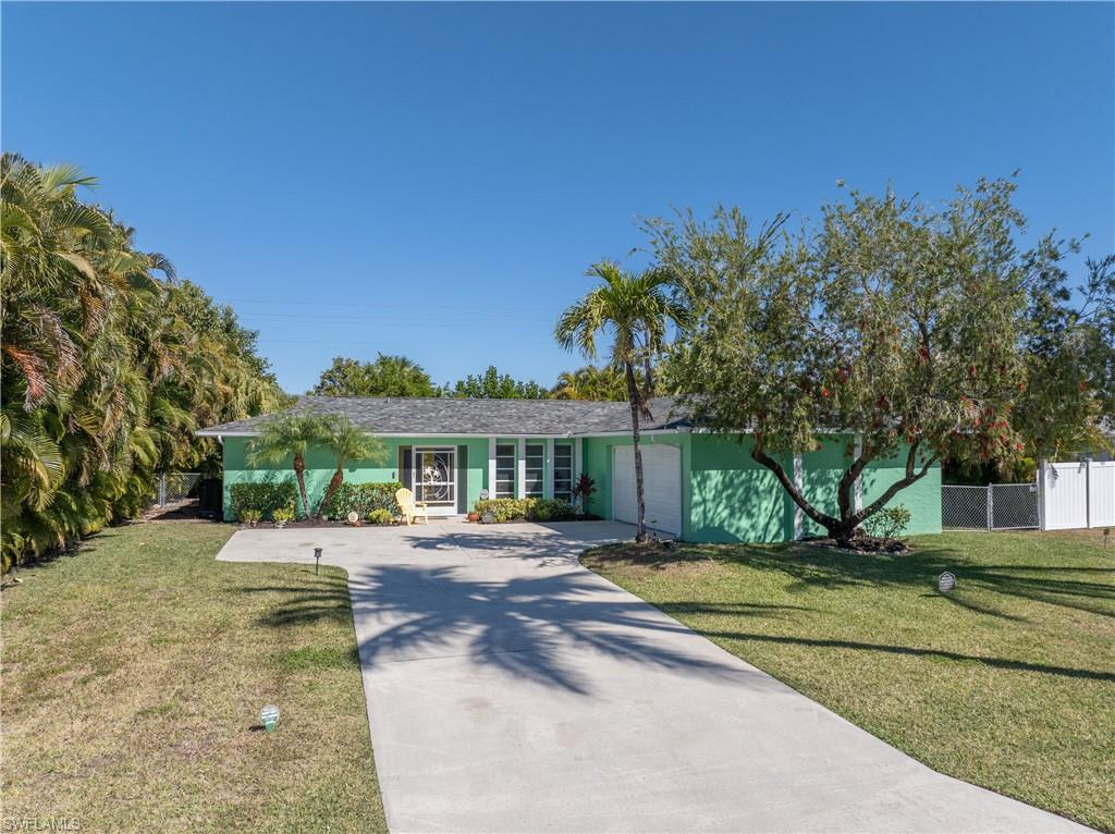 View of Front Street Elevation from Front Left / Driveway Street Entrance [Note Left/Right Property Privacy-Lined Araci Palms]
