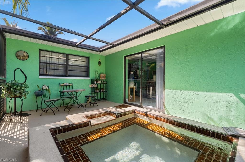 View of the separate Heated Spa with Window to Eastside Ensuite and Slider to Dining Room and Kitchen [Note: New Water Timing Systems for Both Pool and Spa]